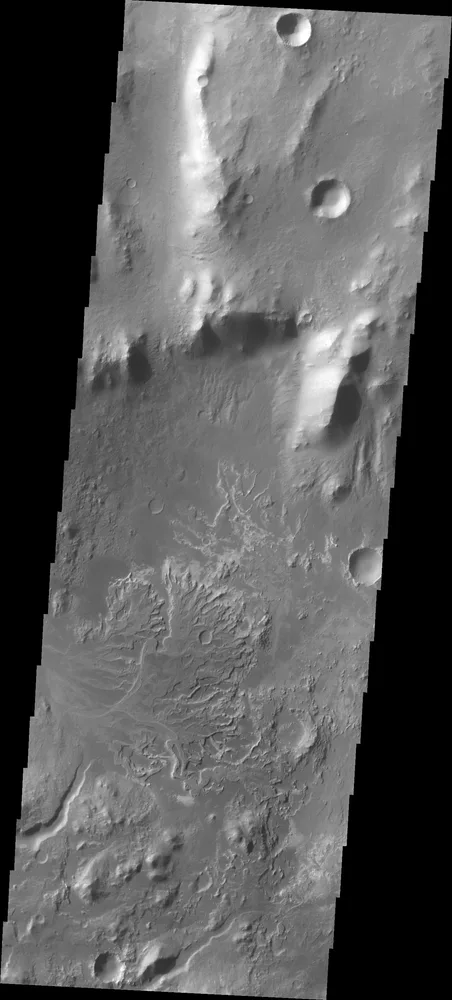 NASA 2001 Mars Odyssey captured this image of a channel entering Eberswalde Crater and depositing a fan-shaped delta on the crater floor.