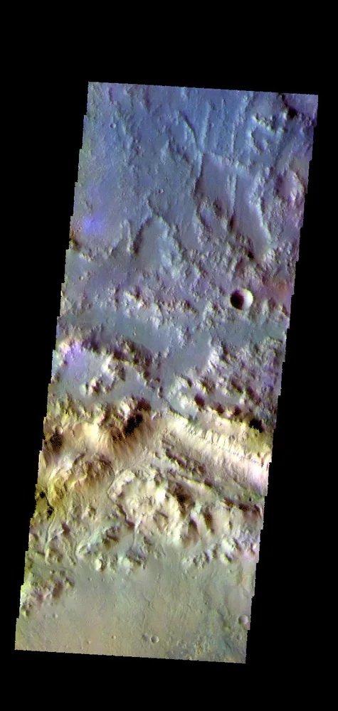 The THEMIS camera contains 5 filters. The data from different filters can be combined in multiple ways to create a false color image. This image from NASA's 2001 Mars Odyssey spacecraft shows part of the northern rim of Horowitz Crater.